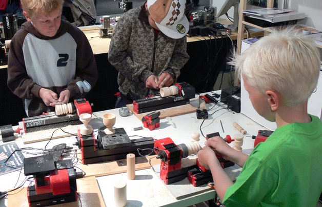 children working with UNIMAT machines